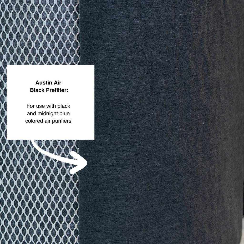 Textured black air filter with a label for Austin Air brand on a dark background